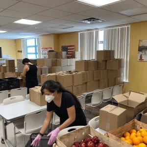 Food Pantry employees packing food for redistribution.