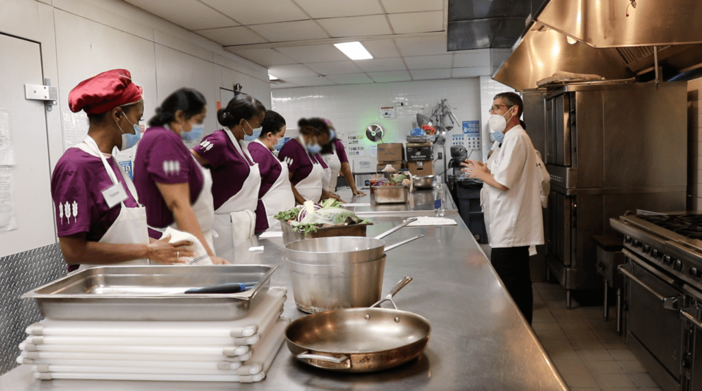 Chef Loren Feldman leads culinary students in a lesson at the Diana H. Jones Innovative Senior Center. The course was offered through a partnership between Hot Bread Kitchen and RiseBoro Community Partnership.