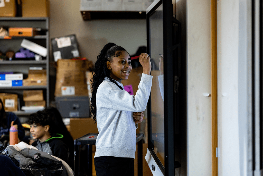 A student learning at RiseBoro's Youth Center